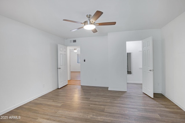 unfurnished bedroom with ceiling fan and hardwood / wood-style flooring