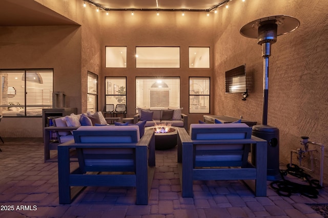 view of patio / terrace featuring an outdoor living space with a fire pit