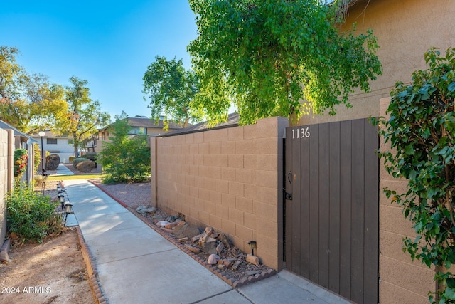 view of gate featuring fence