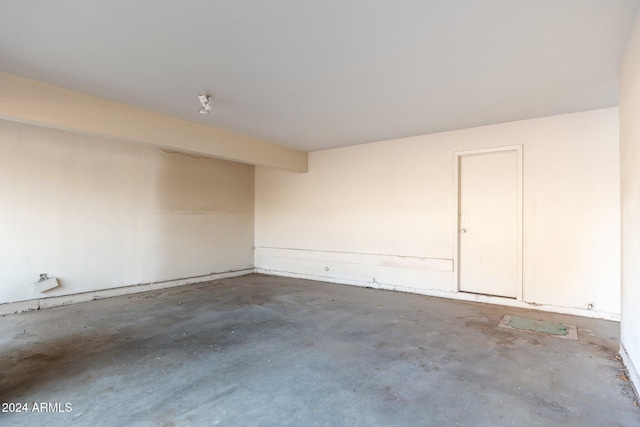 spare room featuring unfinished concrete floors