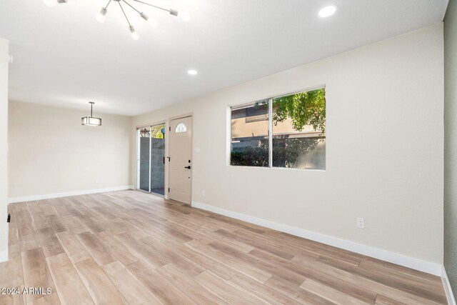 1136 N 84th Pl, Scottsdale, AZ 85257 - entryway with healthy amount of natural light, dark wood finished floors, a textured ceiling, a textured wall, and recessed lighting