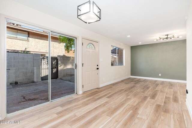 1136 N 84th Pl, Scottsdale, AZ 85257 - entryway featuring wood finished floors, a textured ceiling, and recessed lighting
