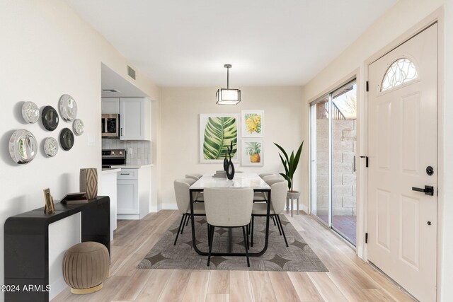 1136 N 84th Pl, Scottsdale, AZ 85257 - unfurnished room with stairs, wood finished floors, and recessed lighting