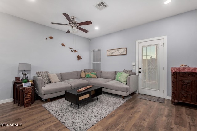 living room with dark hardwood / wood-style floors and ceiling fan