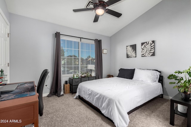 bedroom with light colored carpet, ceiling fan, and lofted ceiling