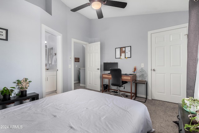 carpeted bedroom with ceiling fan, vaulted ceiling, and ensuite bath