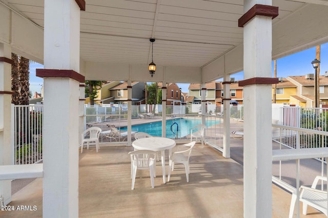 view of swimming pool featuring a patio area