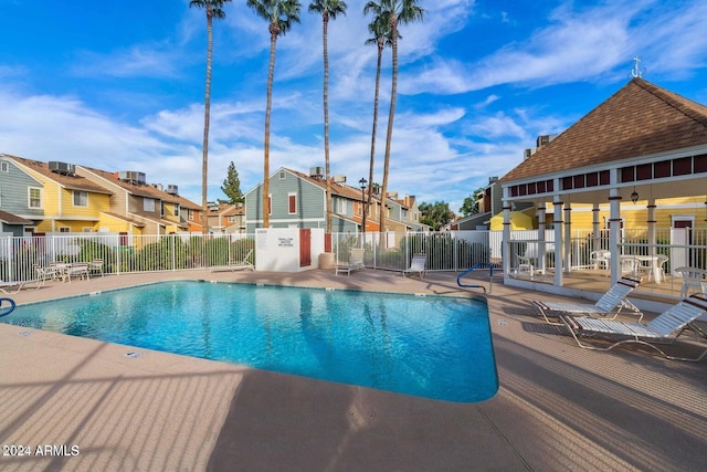 view of swimming pool with a patio