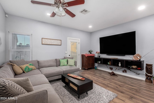 living room with hardwood / wood-style flooring and ceiling fan