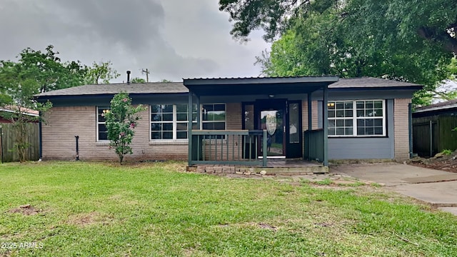 2408 W Saint Kateri Dr, Phoenix, AZ 85041 - single story home with fence, a porch, a front lawn, and brick siding