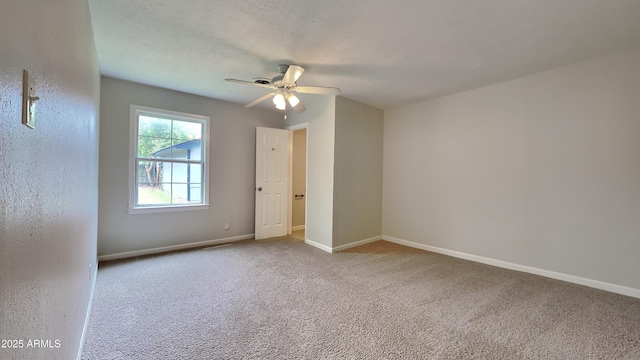 2408 W Saint Kateri Dr, Phoenix, AZ 85041 - carpeted spare room with baseboards and a ceiling fan