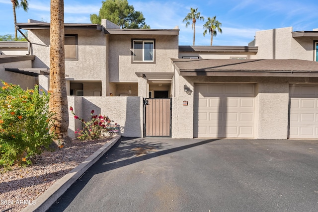 townhome / multi-family property featuring a garage