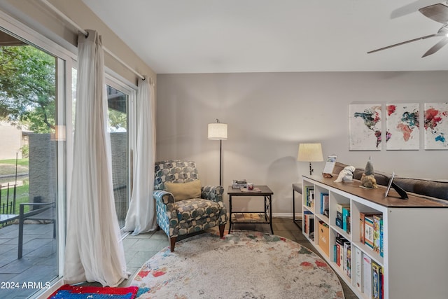 living area featuring ceiling fan