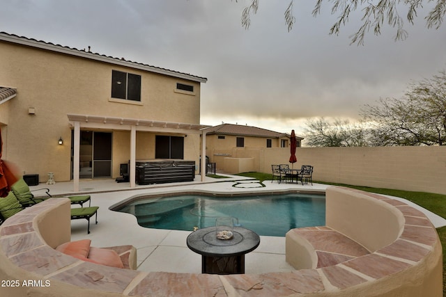 view of pool featuring a patio, a fenced backyard, a fenced in pool, and a hot tub