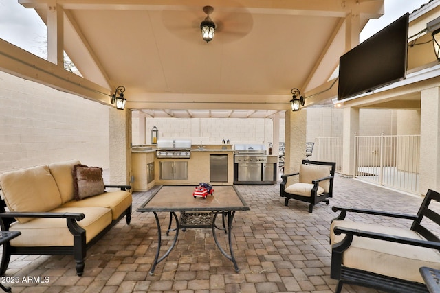 view of patio / terrace featuring an outdoor kitchen, an outdoor hangout area, and area for grilling