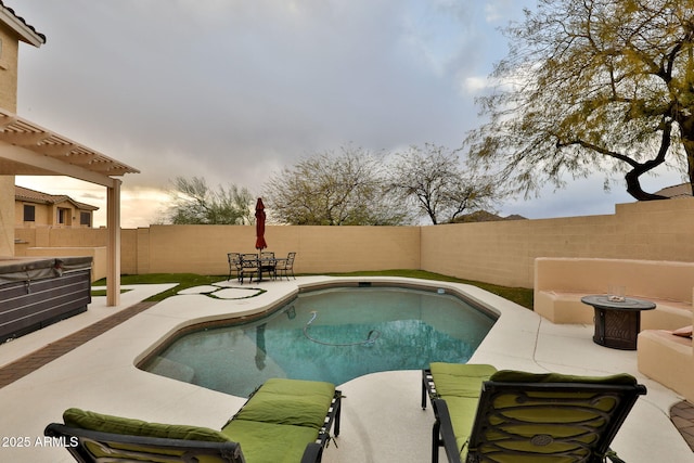 view of swimming pool with a patio, a fenced backyard, and a fenced in pool