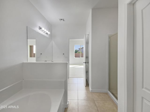 full bath with tile patterned floors, a bath, visible vents, and a stall shower