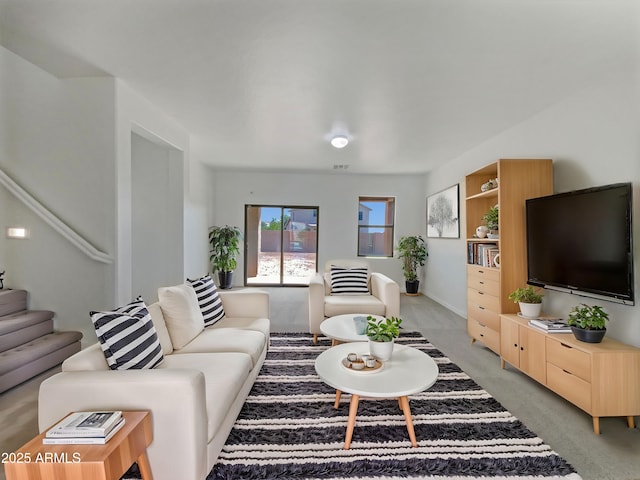 living room featuring light carpet