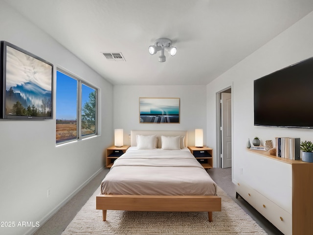 bedroom with carpet flooring, baseboards, and visible vents