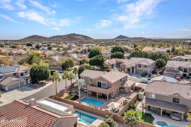 birds eye view of property with a mountain view