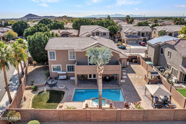 view of swimming pool featuring a patio and a mountain view