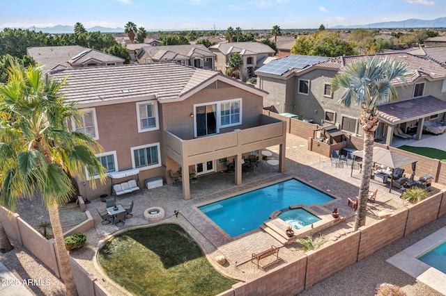 view of swimming pool featuring an in ground hot tub and a patio area