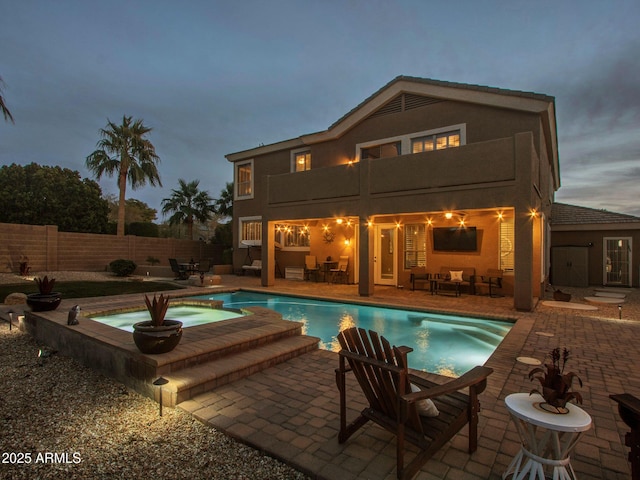 view of swimming pool with an in ground hot tub and a patio area