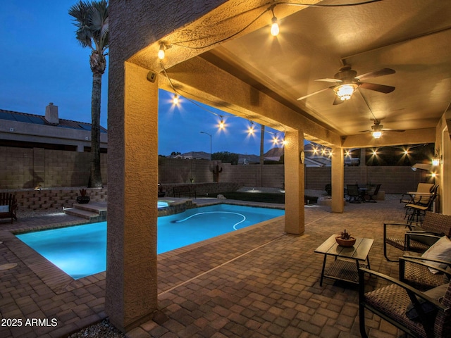 view of swimming pool with a patio area and ceiling fan