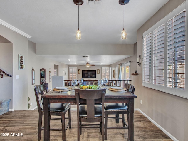 dining room featuring hardwood / wood-style floors and ceiling fan