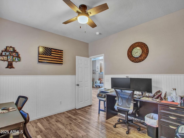 office space with ceiling fan and light wood-type flooring