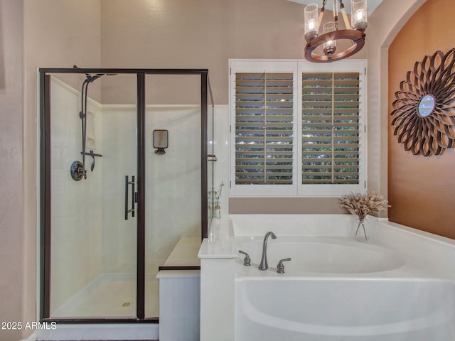 bathroom with an inviting chandelier and plus walk in shower