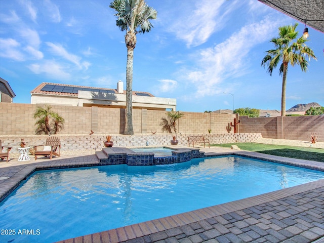 view of pool with an in ground hot tub