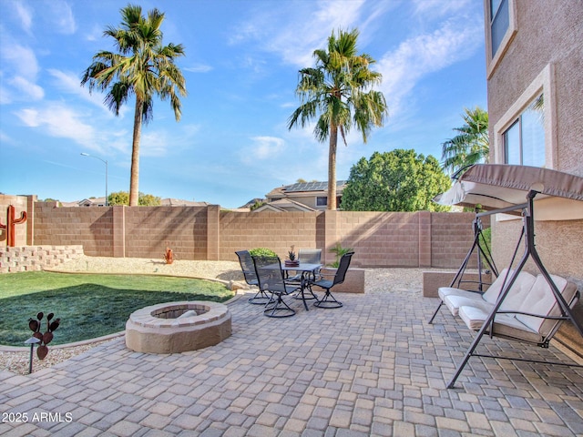 view of patio featuring an outdoor fire pit