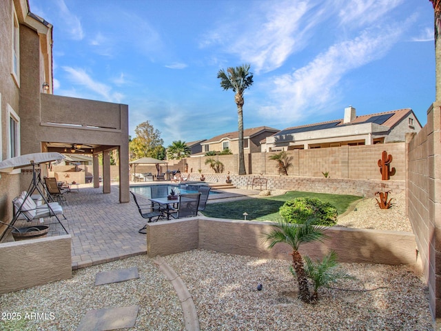 view of patio with a fenced in pool