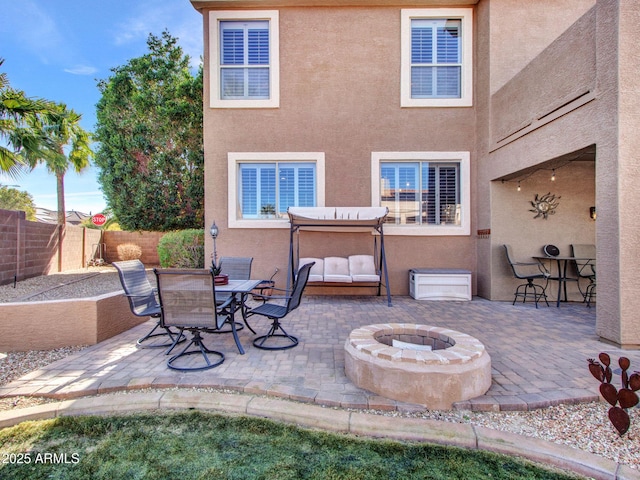 view of patio featuring an outdoor fire pit