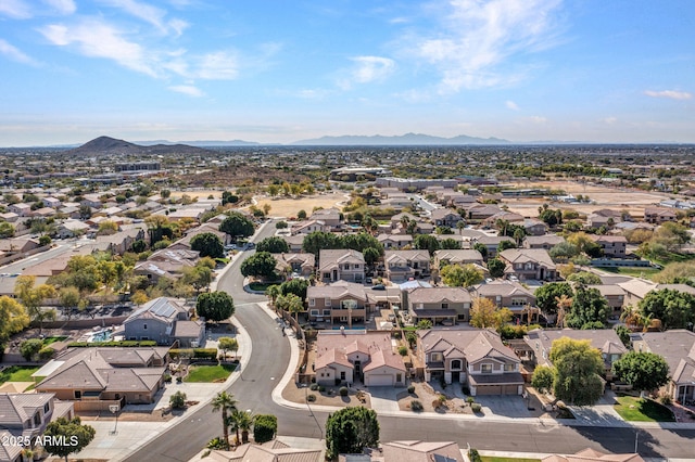 birds eye view of property featuring a mountain view