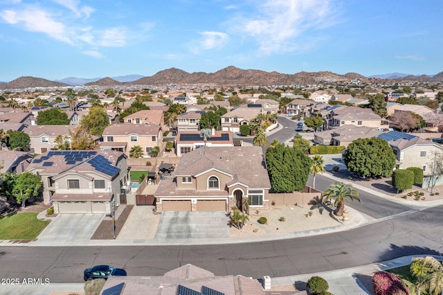 birds eye view of property featuring a mountain view