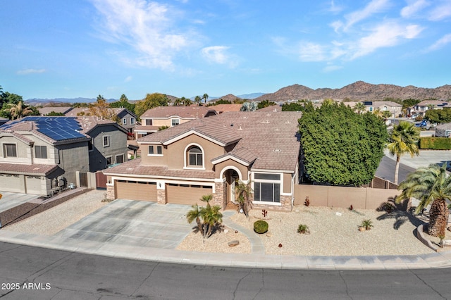 view of front of house with a mountain view and a garage