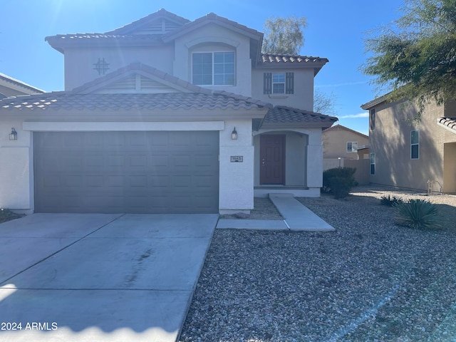 view of front of property with a garage