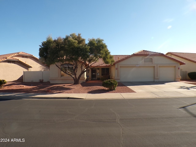 mediterranean / spanish-style house featuring a garage