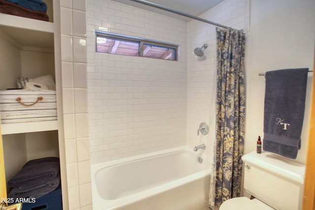 bathroom featuring toilet and shower / bath combo