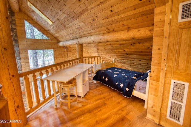 bedroom with hardwood / wood-style flooring, a skylight, high vaulted ceiling, wooden walls, and wooden ceiling