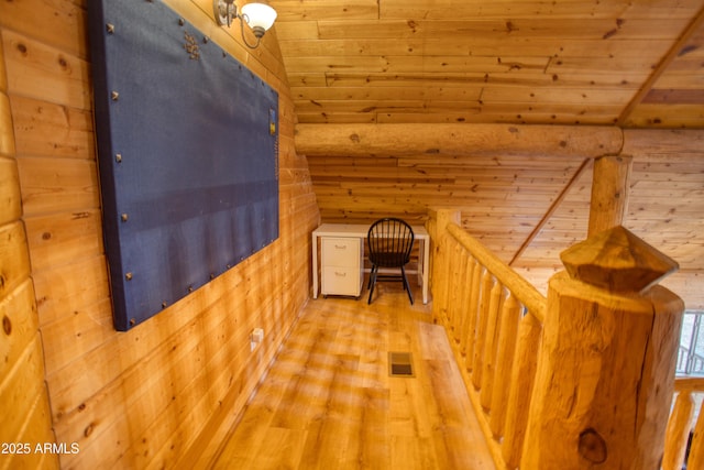 bonus room featuring lofted ceiling, hardwood / wood-style floors, wooden ceiling, and rustic walls