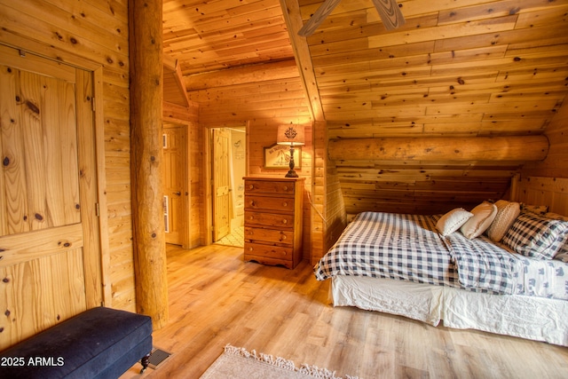 bedroom featuring lofted ceiling, wood ceiling, light wood-type flooring, and wood walls