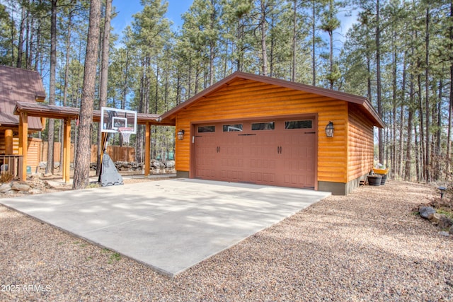 view of side of property with a garage and an outdoor structure