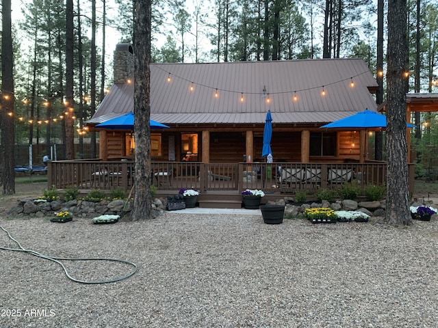 log cabin with a deck