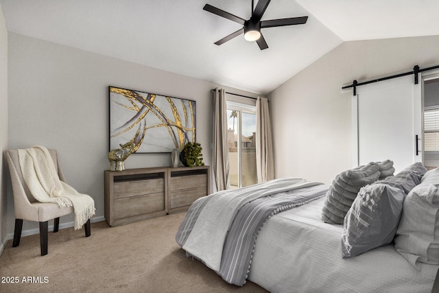 bedroom featuring ceiling fan, lofted ceiling, a barn door, and light carpet