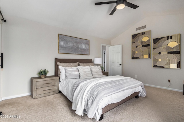 bedroom featuring vaulted ceiling, light colored carpet, and ceiling fan