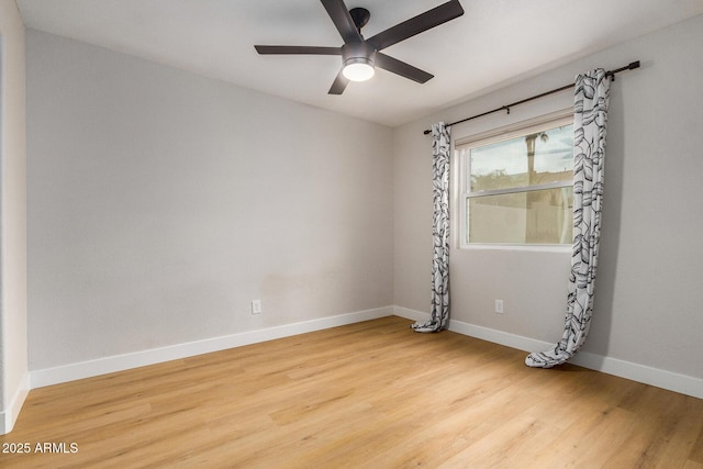 spare room featuring light hardwood / wood-style flooring and ceiling fan