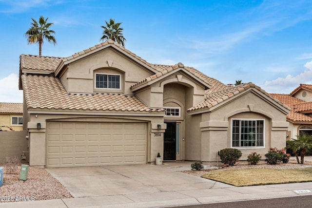 mediterranean / spanish house with a garage